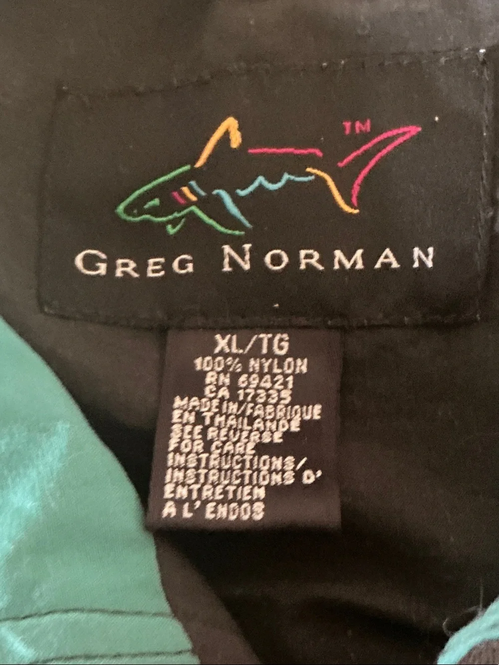 Greg Norman Black Jacket with Multicolor Shark Logo